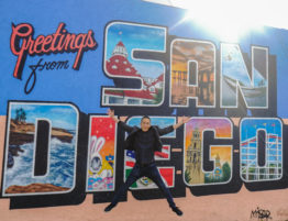 Kevin at the Greetings San Diego mural in North Park